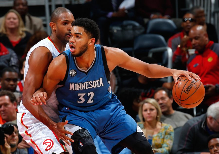 ATLANTA, GA - NOVEMBER 09:  Al Horford #15 of the Atlanta Hawks defends against Karl-Anthony Towns #32 of the Minnesota Timberwolves at Philips Arena on November 9, 2015 in Atlanta, Georgia.  NOTE TO USER User expressly acknowledges and agrees that, by downloading and or using this photograph, user is consenting to the terms and conditions of the Getty Images License Agreement.  (Photo by Kevin C. Cox/Getty Images)