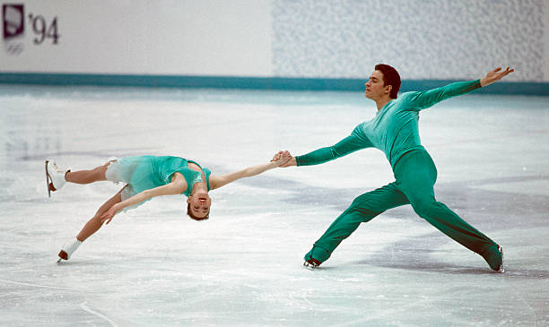 Sergei Grinkov and Ekaterina Gordeeva of Russia competing in the pairs figures skating event during the Winter Olympic Games in Lillehammer, Norway, circa February 1994.  The couple won the gold medal in the event. (Photo by Eileen Langsley/Popperfoto via Getty Images/Getty Images)